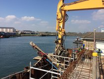 Poole Bridge - Combi coated Ischebech 52/26 'raking passive tension piles' being installed at Poole
